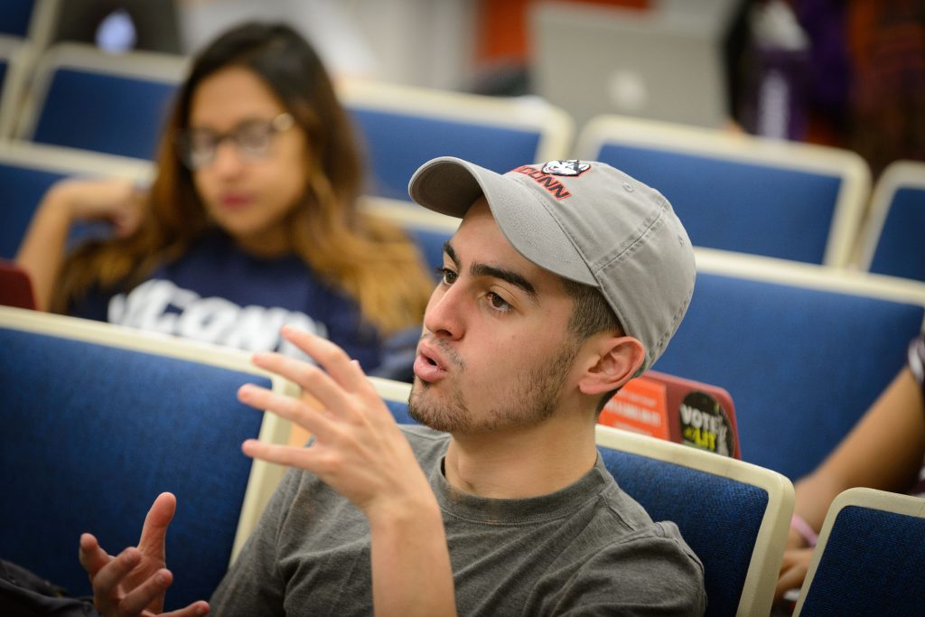 Michael Correia '19 (CLAS) discusses election polling in Professor Charles Venator-Santiago's political science class on Nov. 4, 2016. (Peter Morenus/UConn Photo)