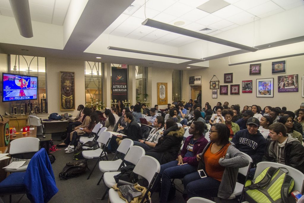 Students watch live as the 2016 presidential election unfolds on television at the African American Cultural Center in the Student Union on Nov. 8. (Garrett Spahn/UConn Photo)