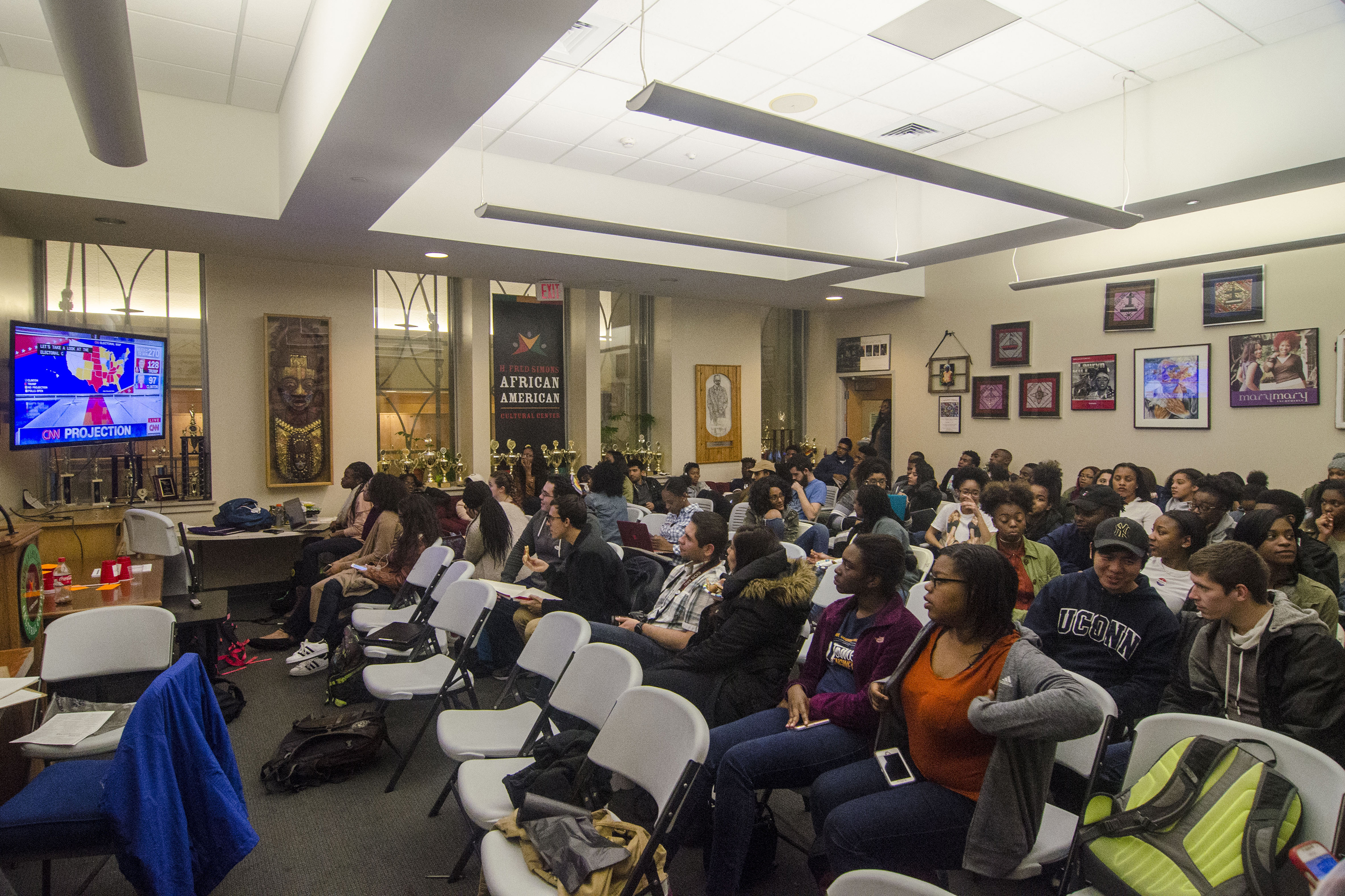 Students watch live as the 2016 presidential election unfolds on television at the African American Cultural Center in the Student Union on Nov. 8. (Garrett Spahn/UConn Photo)