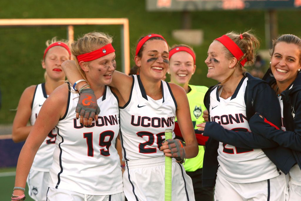 Anna Middendorf (#19) and Charlotte Veitner (#26) celebrate the Huskies' win over Syracuse in the NCAA second round on Nov. 13. (Michael Okoniewski/Syracuse University Photo)