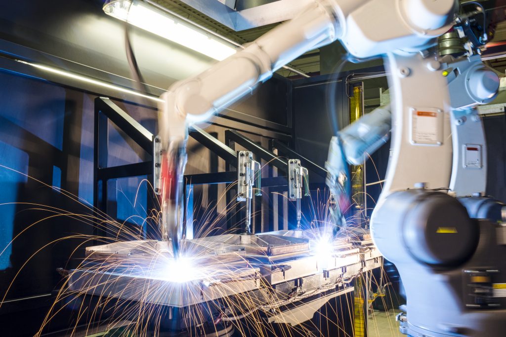 High-tech, industrial robotic welding machines in operation. (Getty Images)