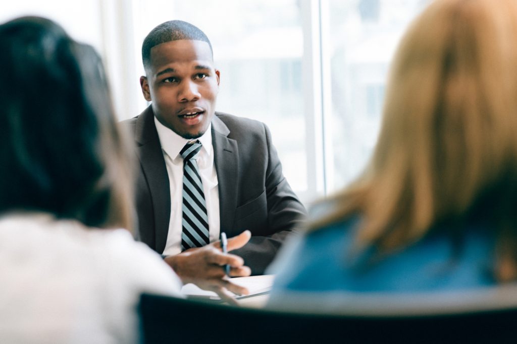 Two women at a meeting with a lawyer. (ferrantraite/Getty Images)