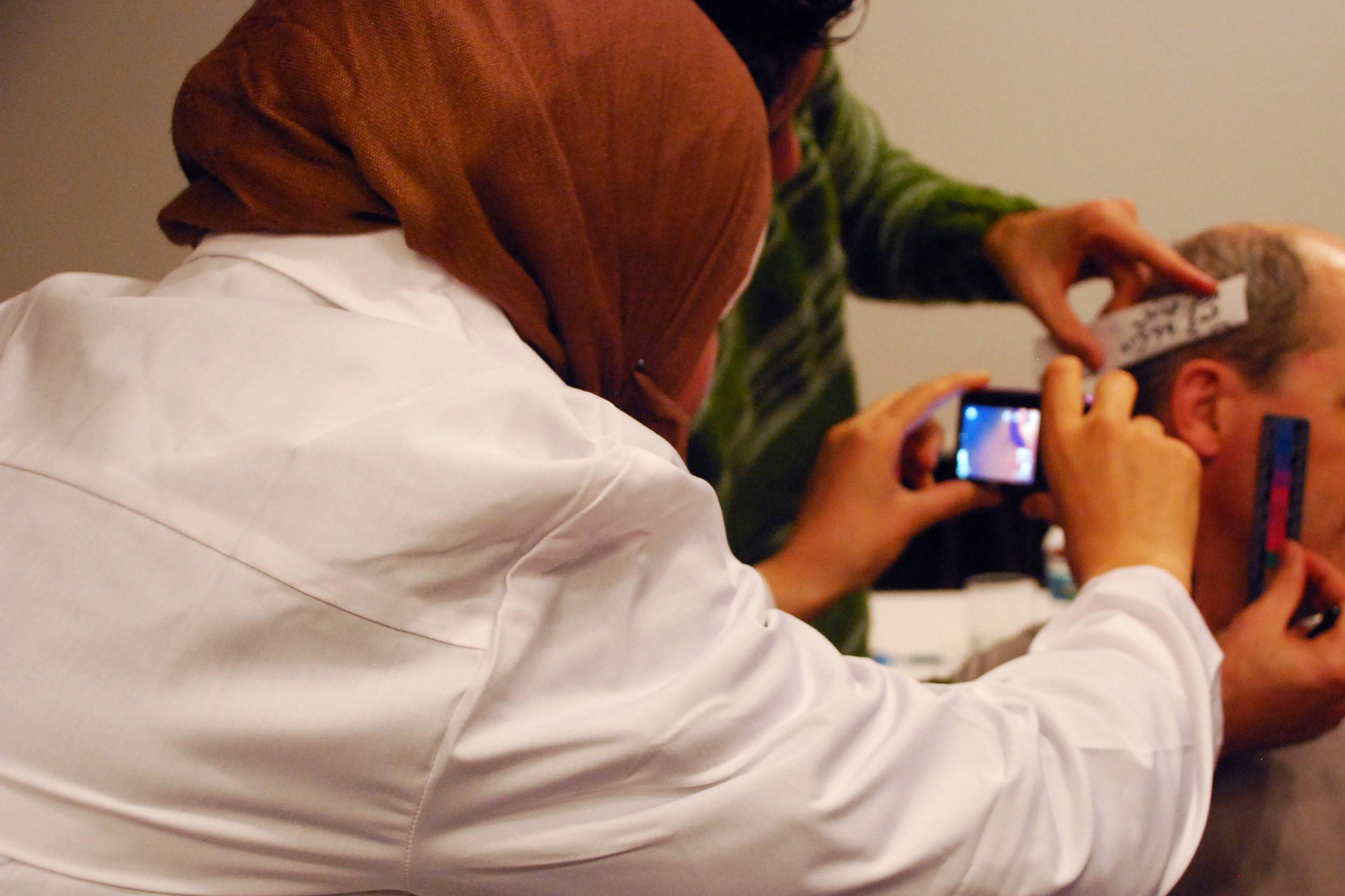 A Syrian physician being trained how to document evidence of torture. (Physicians for Human Rights Photo)