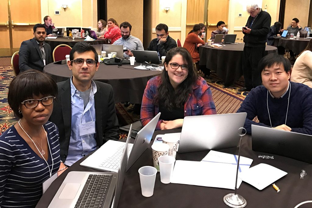 Enuma Ezeife, Avinash Chugani, Alexandra Buchanan and Ted Jin made up the team of UConn graduate students who won the APICS Northeast Student Competition (Ryan Baldassario/UConn School of Business)