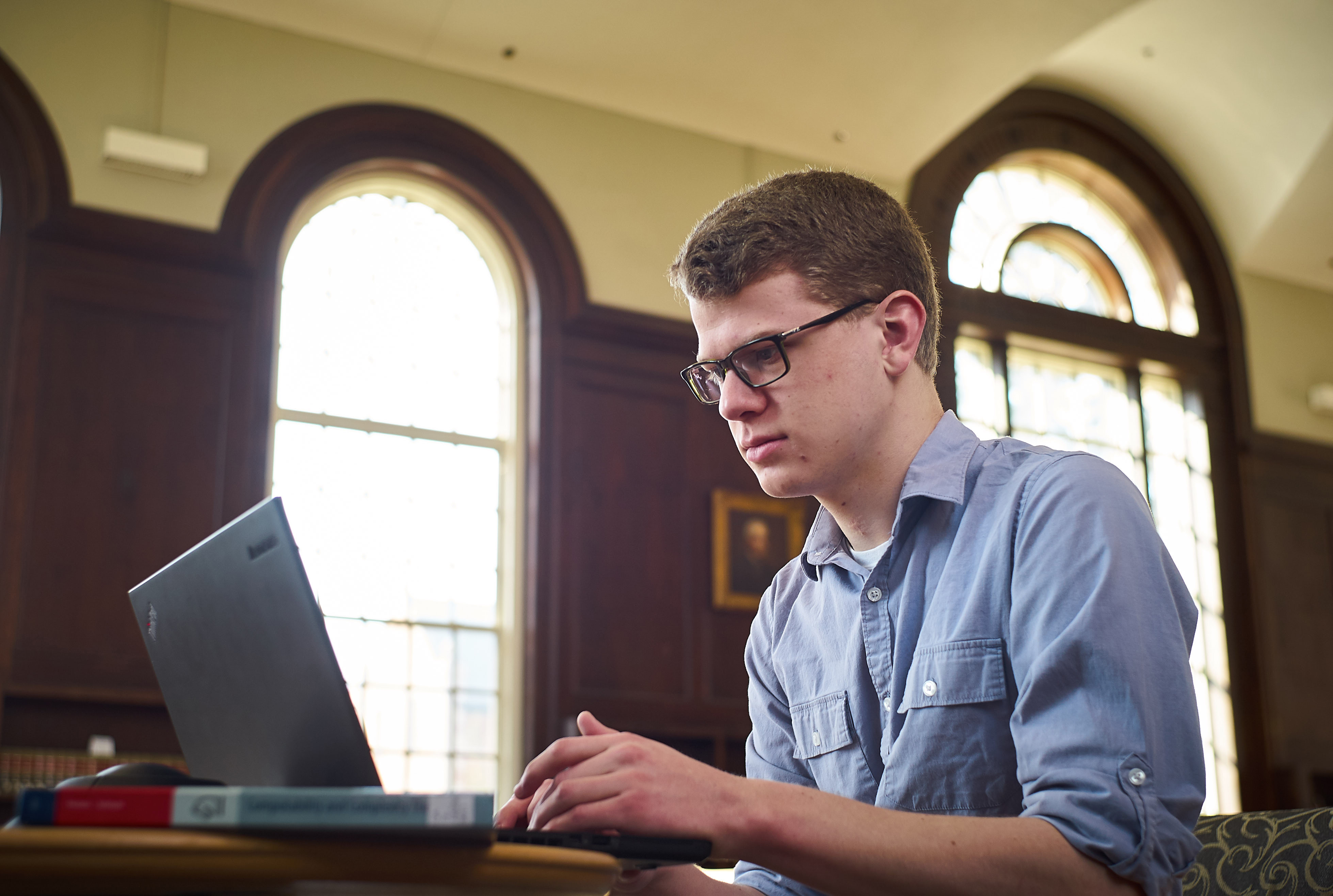 Tyler Daddio '18 (ENG,CLAS) at the Wilbur Cross South Reading Room on April 11, 2017. (Peter Morenus/UConn Photo)