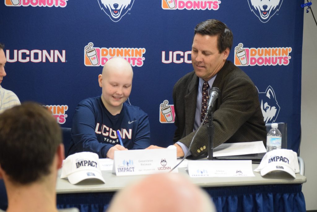 Ten-year old Genevieve Neiman, who has leukemia, joined the women's tennis program with her signing of a Husky Letter of Intent. (Athletic Communications/UConn Photo)