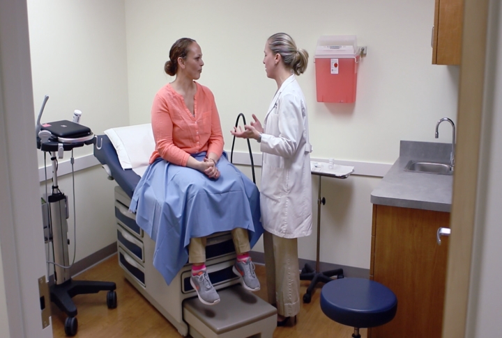 Kim DeGumbia talks with Dr. Danielle Luciano about the minimally invasive procedure she underwent at UConn Health. (Photo by Frank Barton)