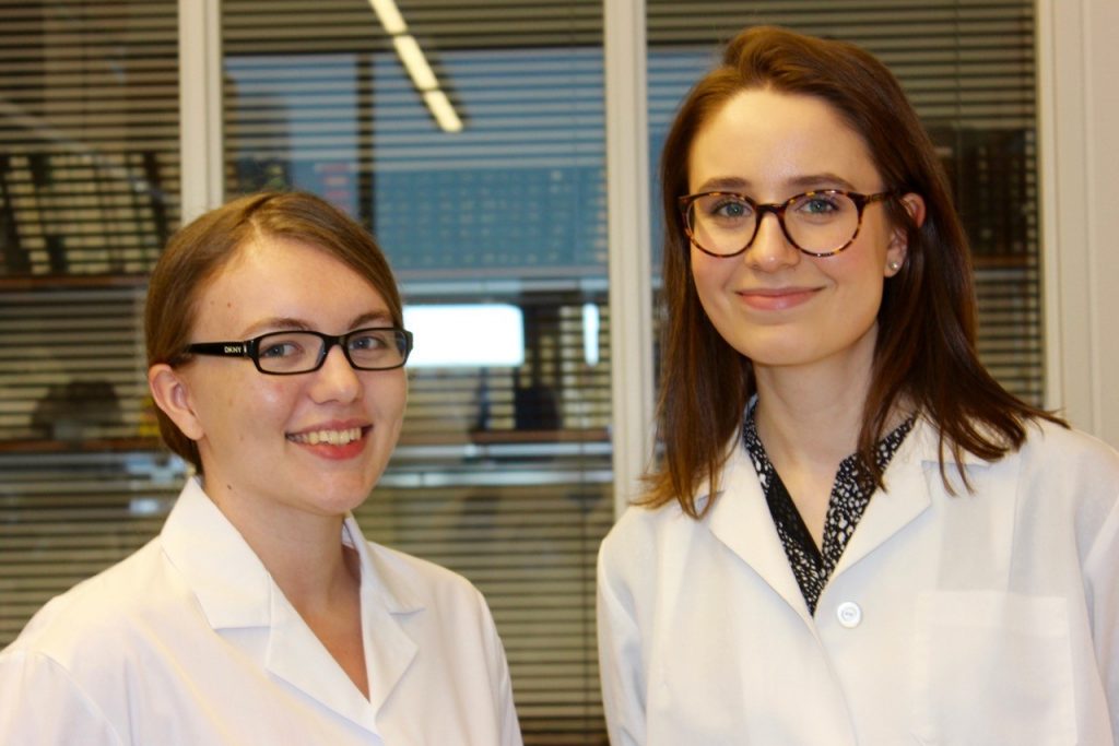 Recent graduates Caitlin Jagla '17 (CLAS), left, and Ashley Hine '17 (CLAS) are among the students who have gained research experience in pharmacy professor Debra Kendall's lab. (Sheila Foran/UConn photo)