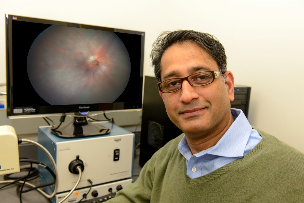 Royce Mohan in his lab at UConn Health. (Janine Gelineau/UConn Health Photo)