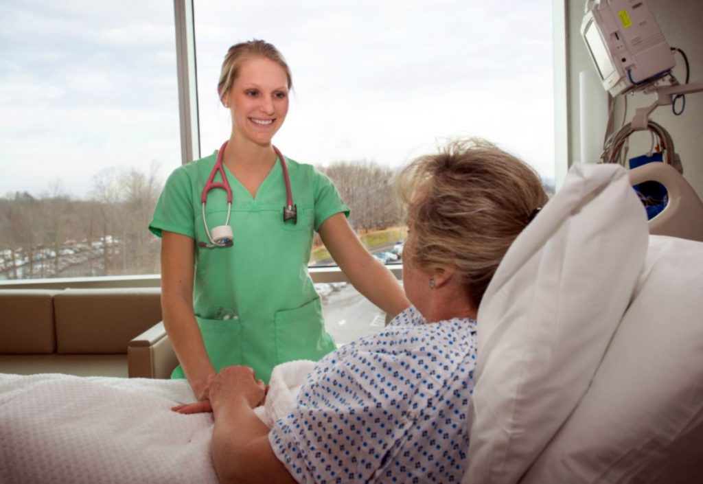 Nurse Courtney Hurlbert cares for a patient at the new hospital tower of UConn John Dempsey Hospital at UConn Health (Photo: UConn Health/Janine Gelineau).