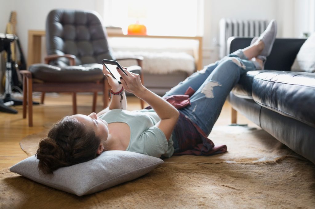 Young woman using a smart phone. (Getty Images)