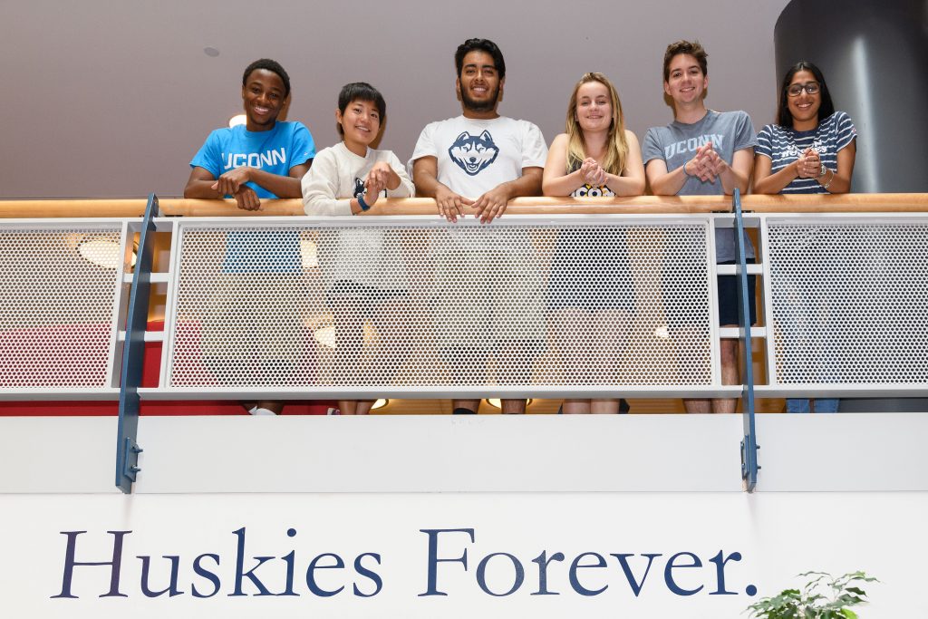 From left, freshmen Ryan Wellington '21 (BUS), livia Knuth '21 (CAHNR), Bryant Cuapio '21 (SFA), Cassidy Colosi '21 (CLAS), Everett Grethel '21 (SFA), and Prachi Udeshi '21 (CAHNR) at the Student Union. (Peter Morenus/UConn Photo)