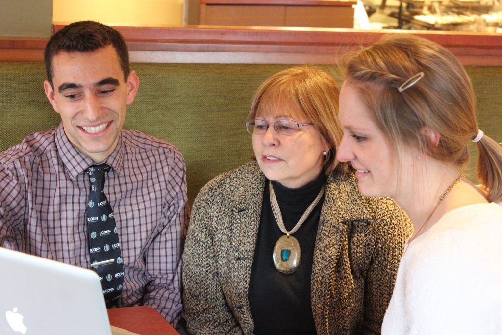 Jason Funaro with Marie Smith and Kate Steckowych (Sheila Foran/UConn Photo)