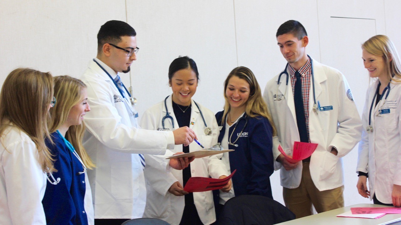 Students lined up at blood pressure clinic.