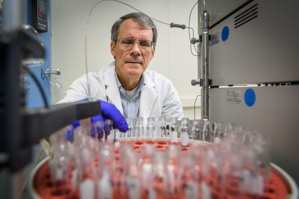 UConn Health periodontist Frank Nichols at his lab at UConn Health in Farmington on Oct. 30, 2017. (Peter Morenus/UConn Photo)