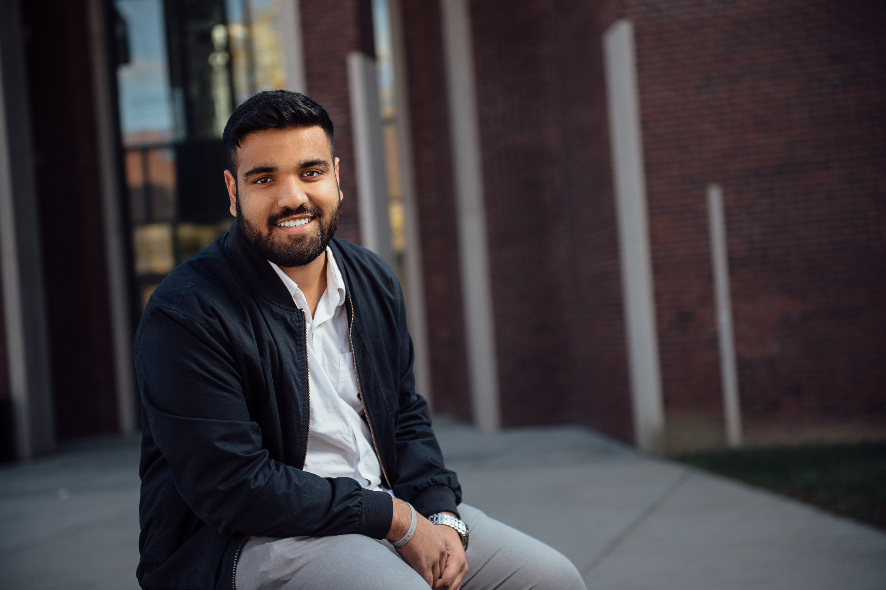 Joel Thomas, an international student from Dubai, outside the School of Business. (Nathan Oldham/UConn Photo)