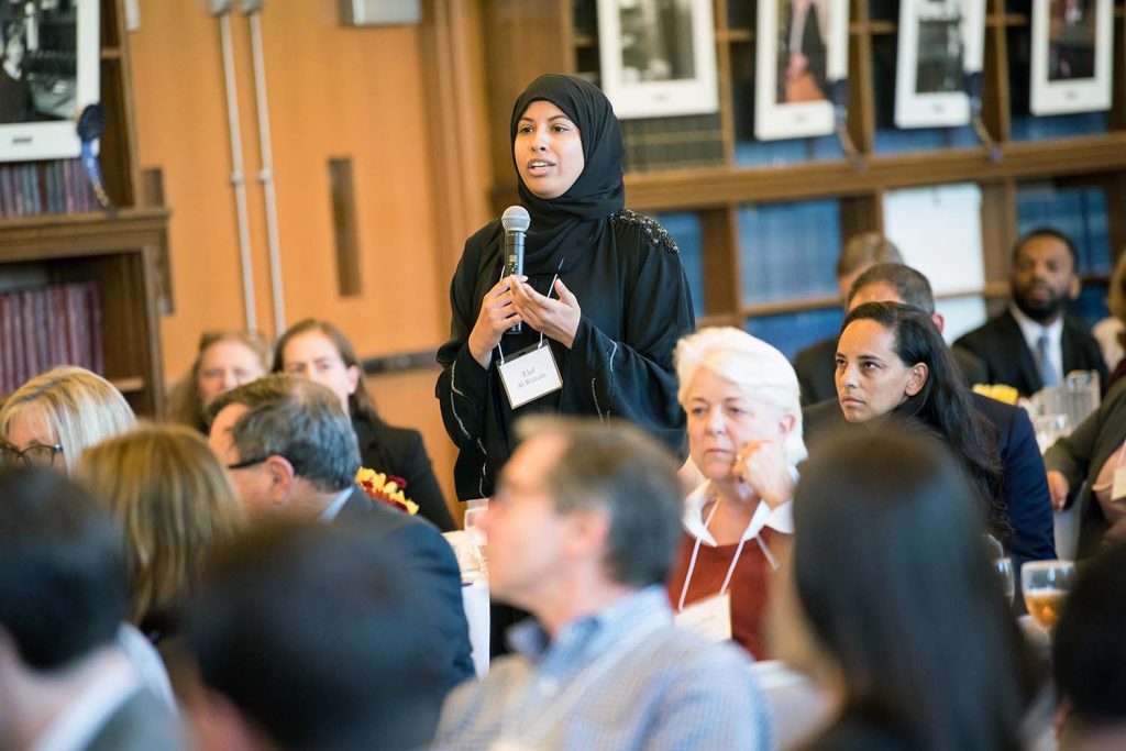 An audience member asks a question at the religious freedom syposium.