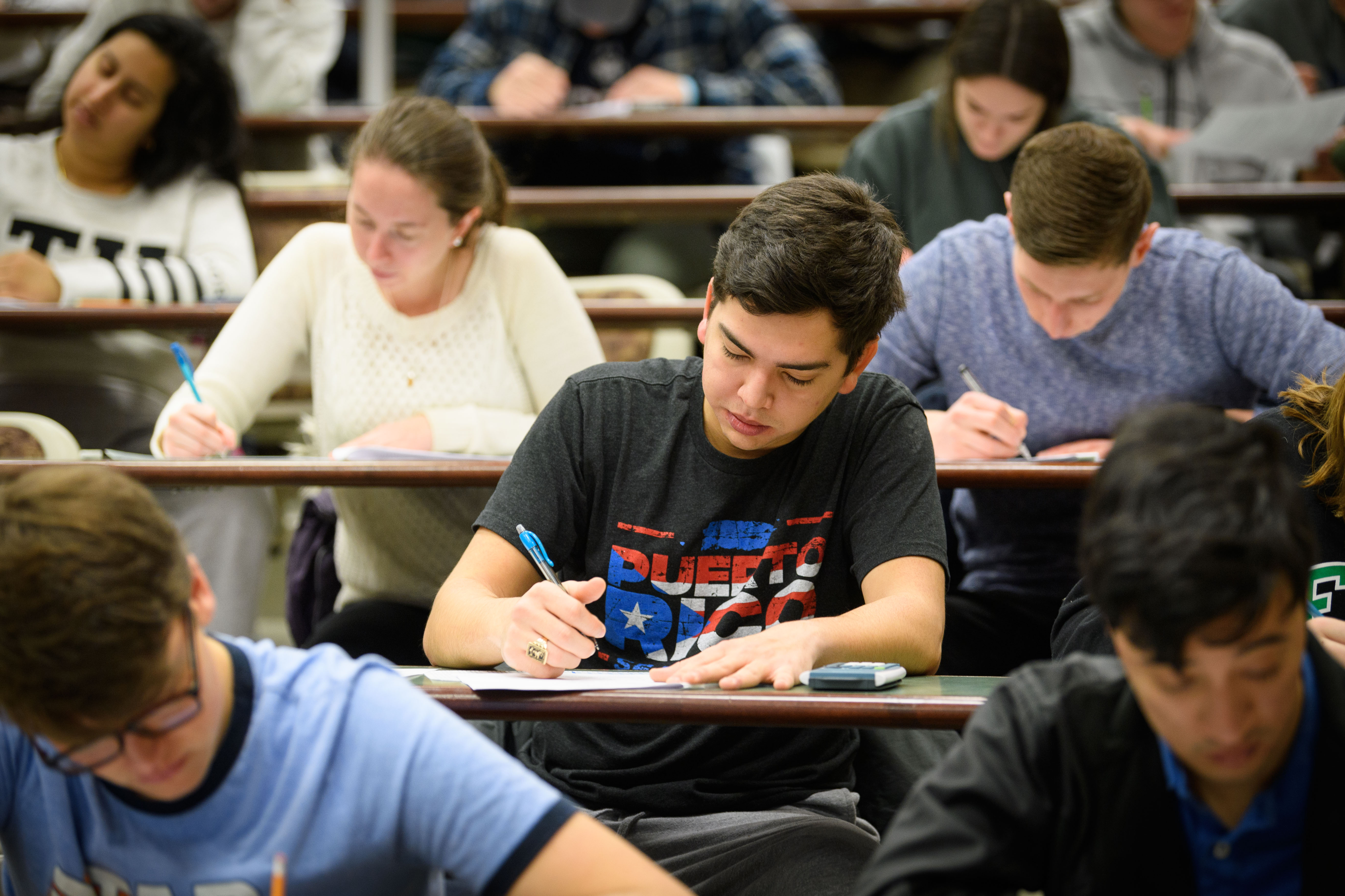 Sophomore Daniel Cintron takes a final exam at the Physics Building on Dec. 15, 2017. (Peter Morenus/UConn Photo)