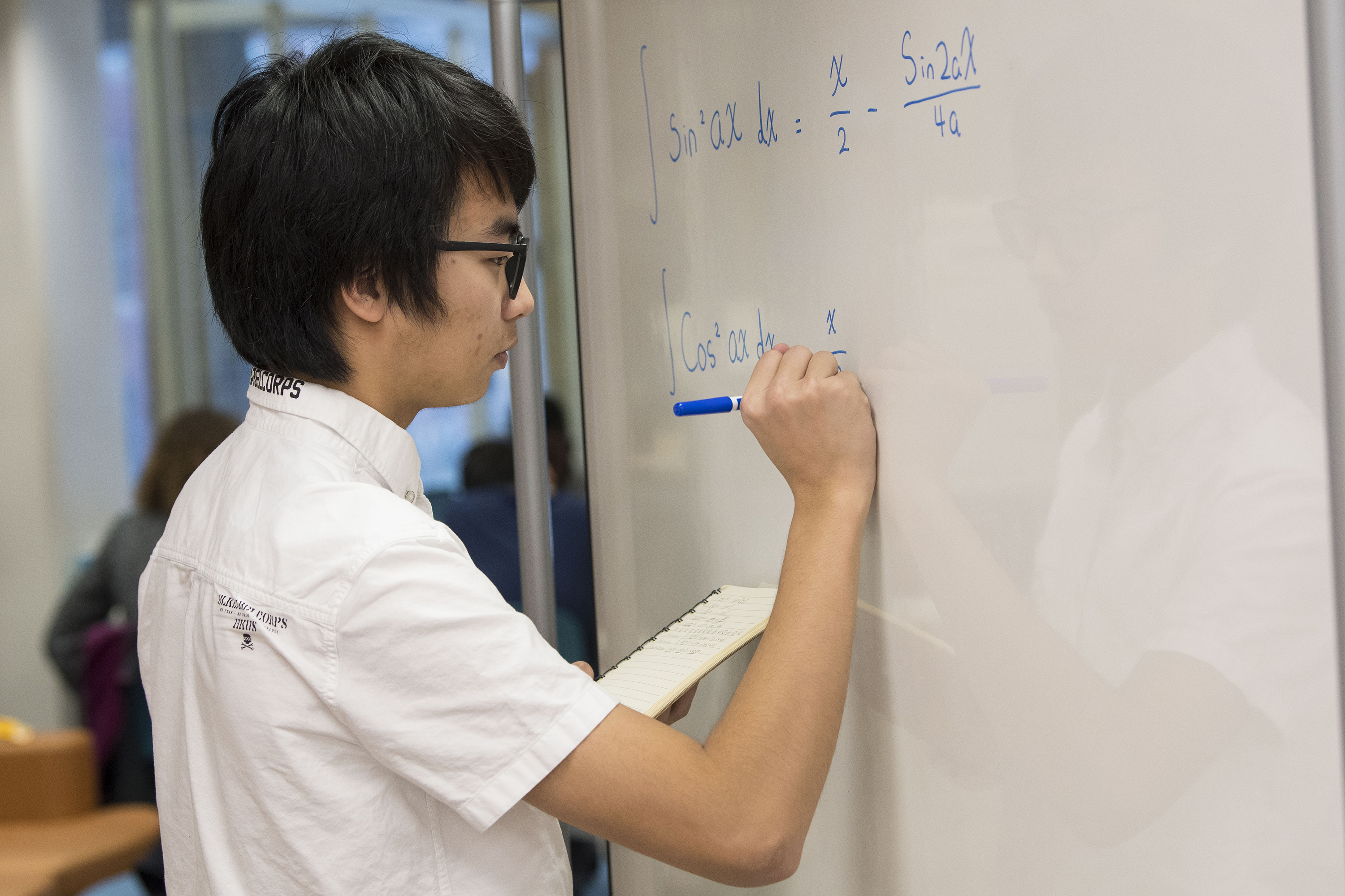 International Student Wei ‘Toby’ Xinhai studying math at the Homer Babbidge Library on Dec. 12, 2017. (Sean Flynn/UConn Photo)