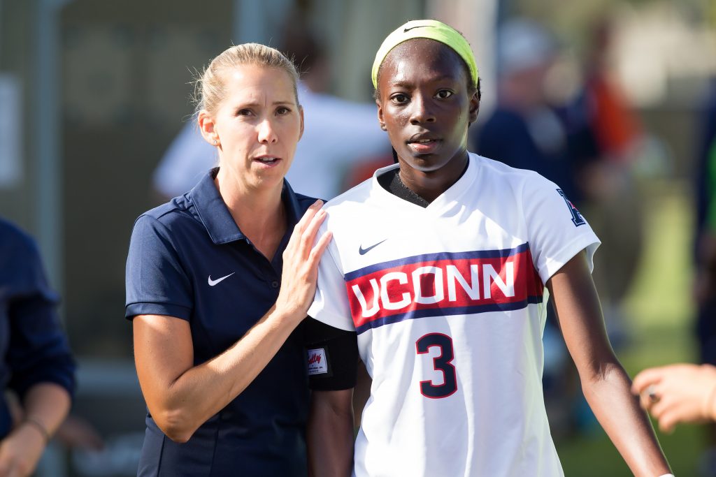 Margaret (Tietjen) Rodriguez with player Yamilee Eveillard. (Stephen Slade '89 (SFA) for UConn)