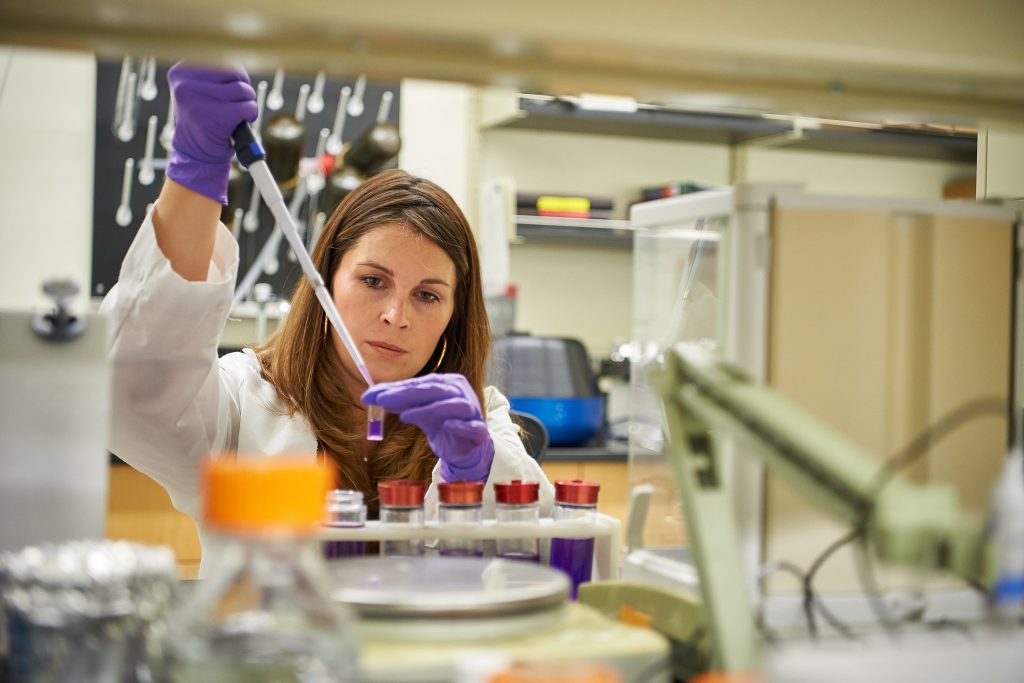 Nicole Wagner, CEO of UConn TIP company LambdaVision, works in the lab at the Cell and Genome Sciences Building in Farmington. (Peter Morenus/UConn Photo)