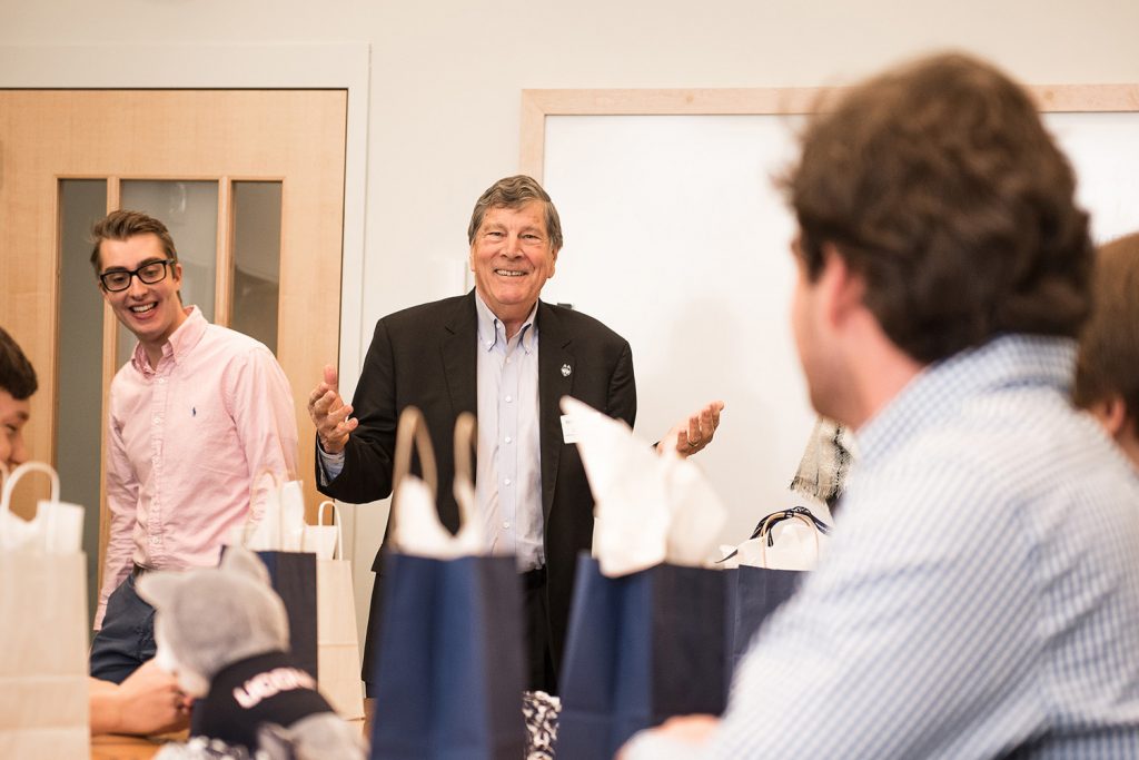 School of Business Dean John A. Elliott pictured with students. (Nathan Oldham/UConn photo)