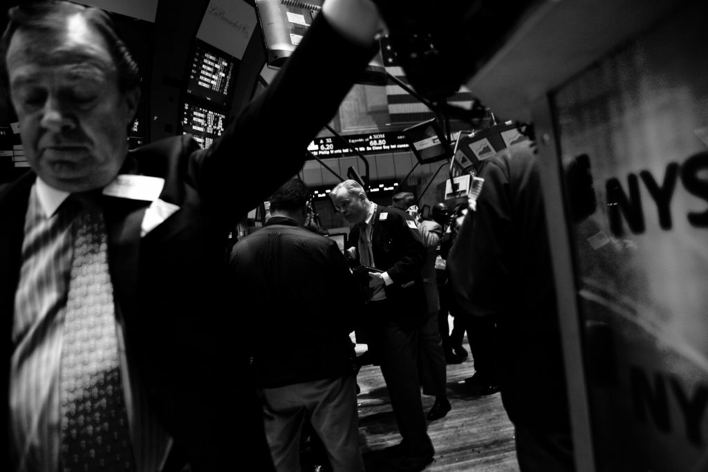 Traders work on the floor of the New York Stock Exchange in the New York financial district on Wall Street. (Jeff Hutchens/Edit by Getty Images)