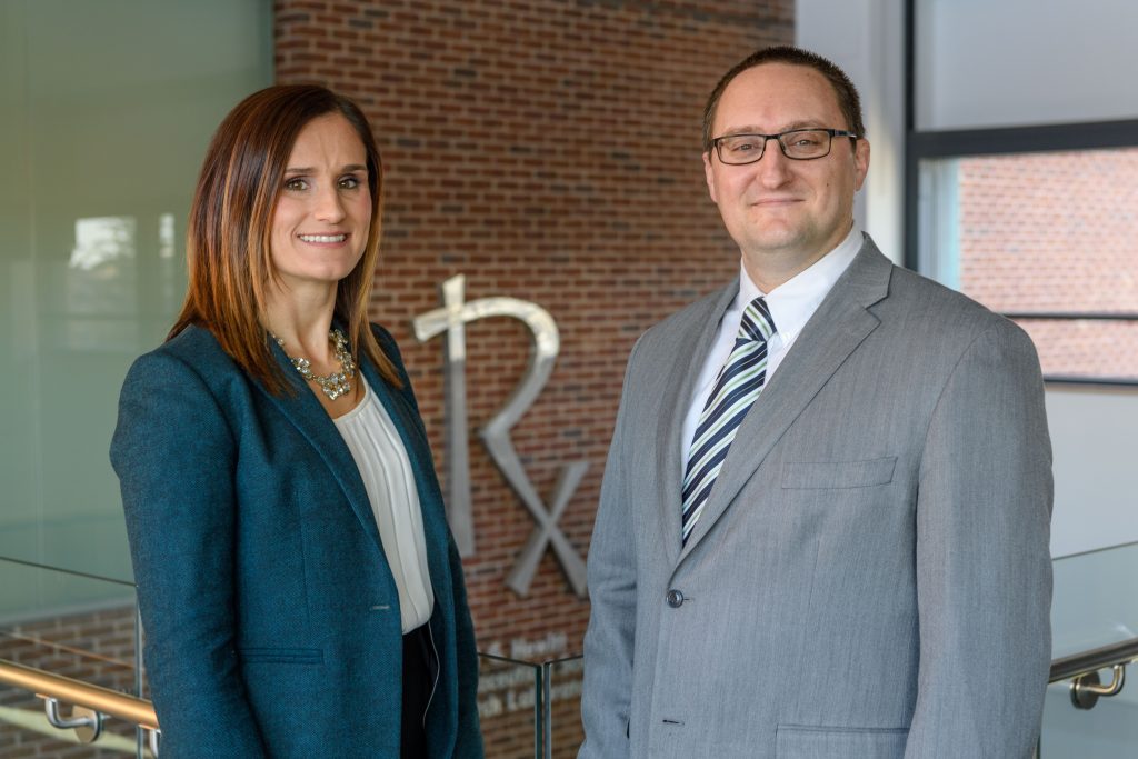 Diana Sobieraj, left, assistant professor of pharmacy practice, and William Baker '02 (Phr) '04 Pharm.D., associate professor of pharmacy practice at the Pharmacy/Biology Building on Feb. 28, 2018. (Peter Morenus/UConn Photo)