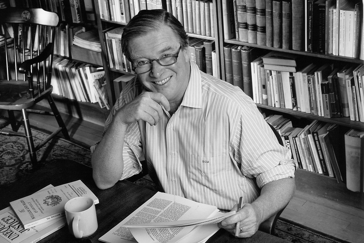 Hugh Macgill, former law school dean who died recently, in an archival photo sitting in his office.