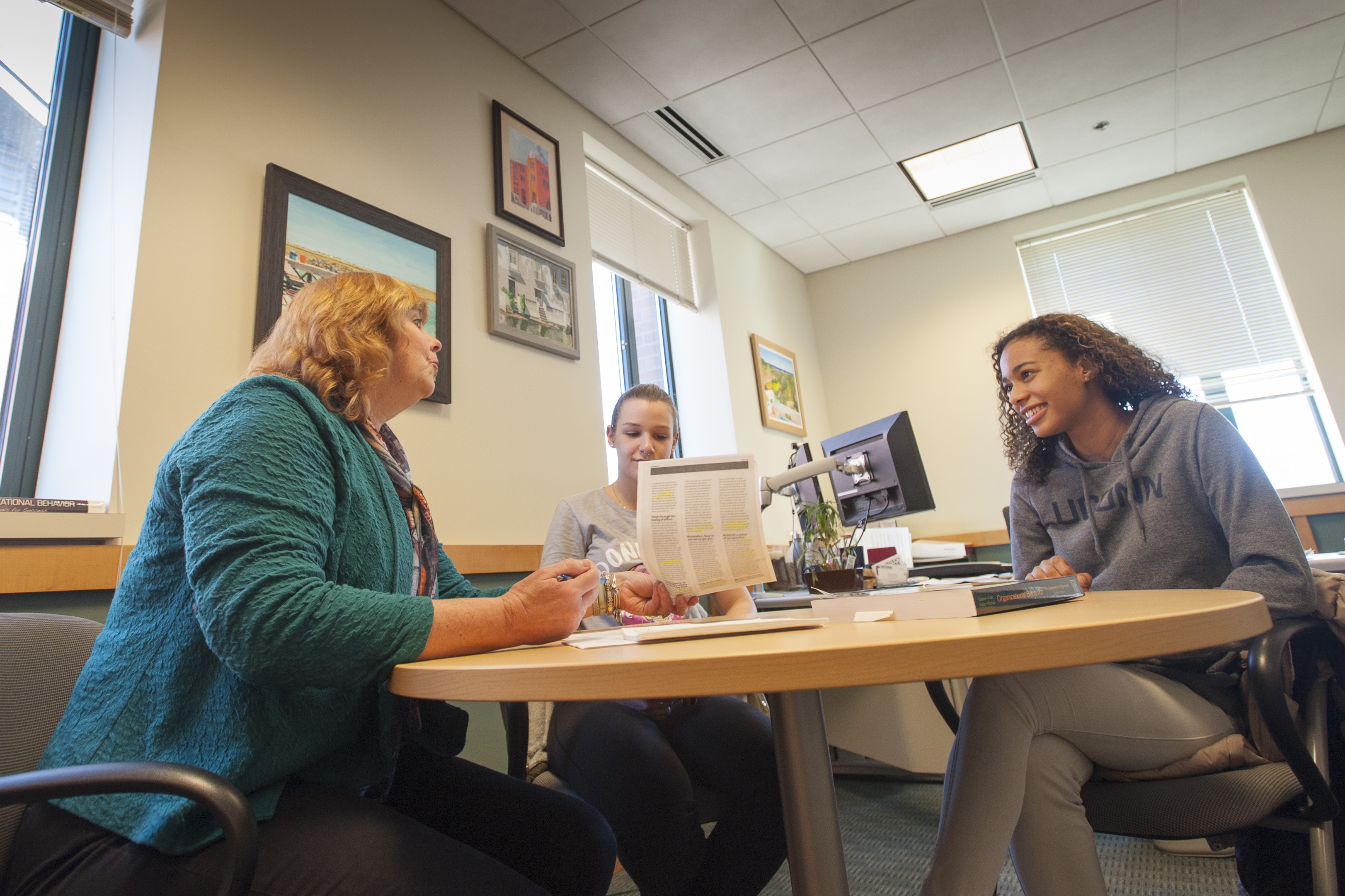 Lucy Gilson meeting with students.