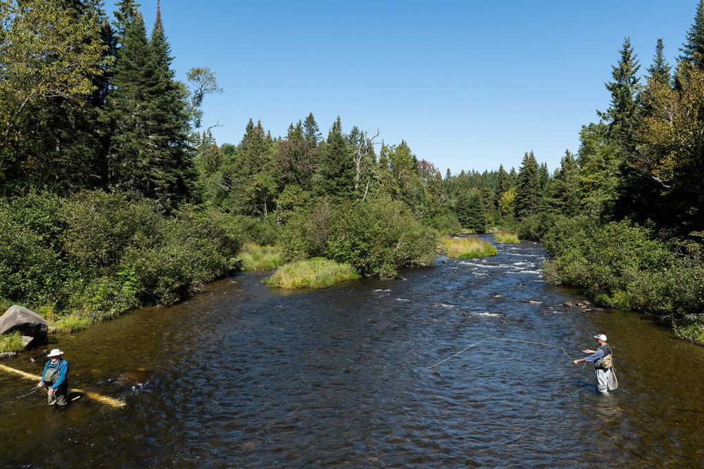 UConn Prof. Janet Pritchard is documenting the complexities of life along the Connecticut River watershed through photography, as in this picture of fly fishing in Pittsburg, N.H. (Photo courtesy of Janet Pritchard)