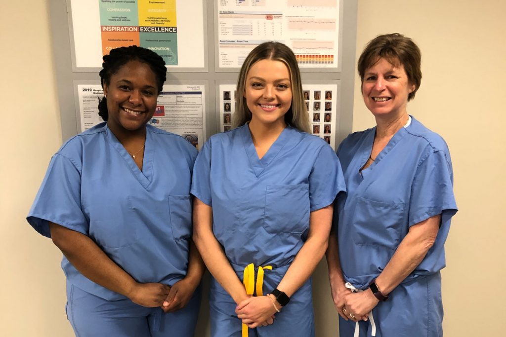 Portrait of recipients in scrubs outside the OR