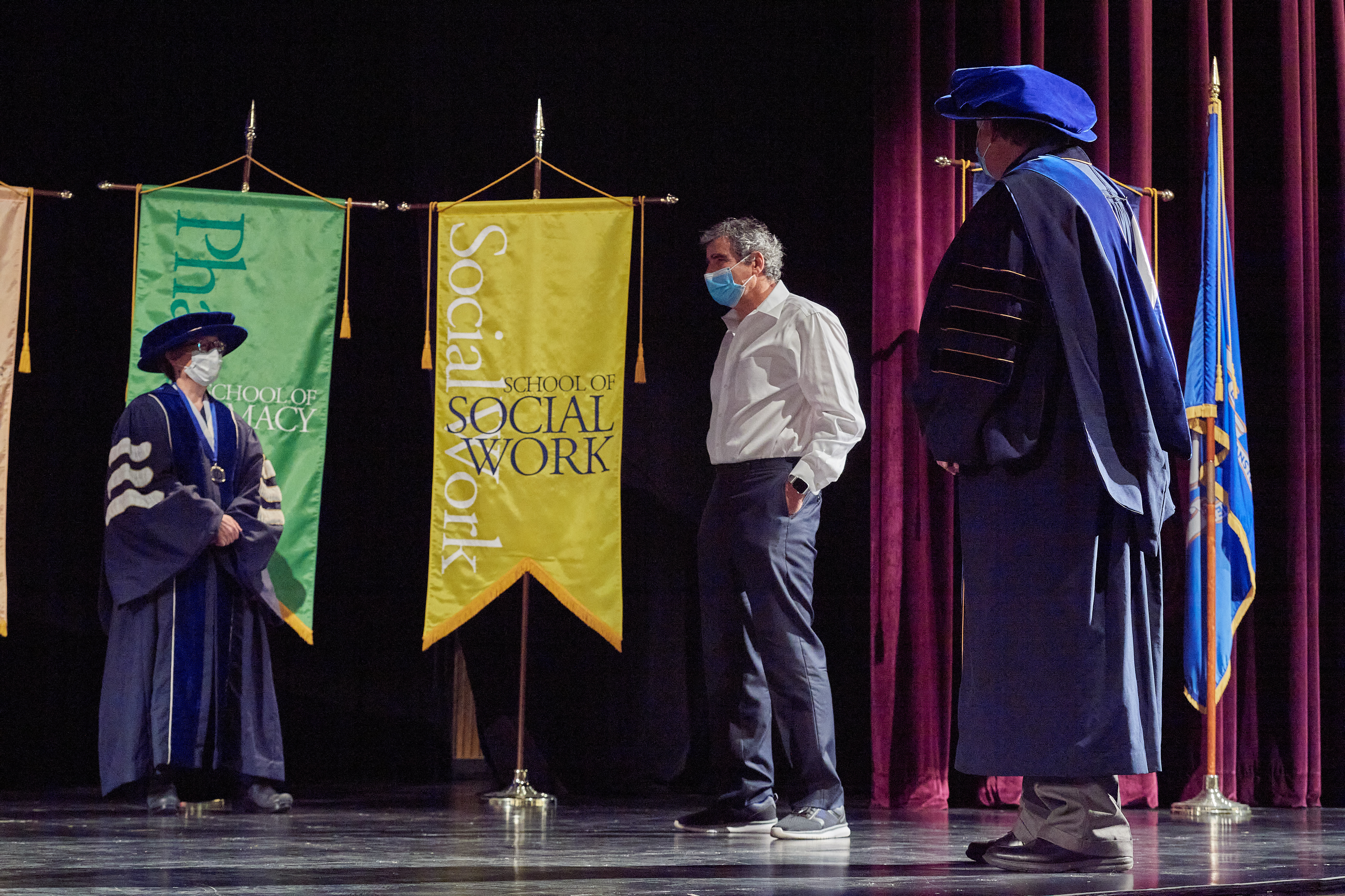 President Thomas Katsouleas speaks with Letita Naigles, left, University marshall, and Del Siegle, mace bearer, before the virtual Commencement ceremony broadcast from the Jorgensen Center for the Performing Arts on May 9, 2020.