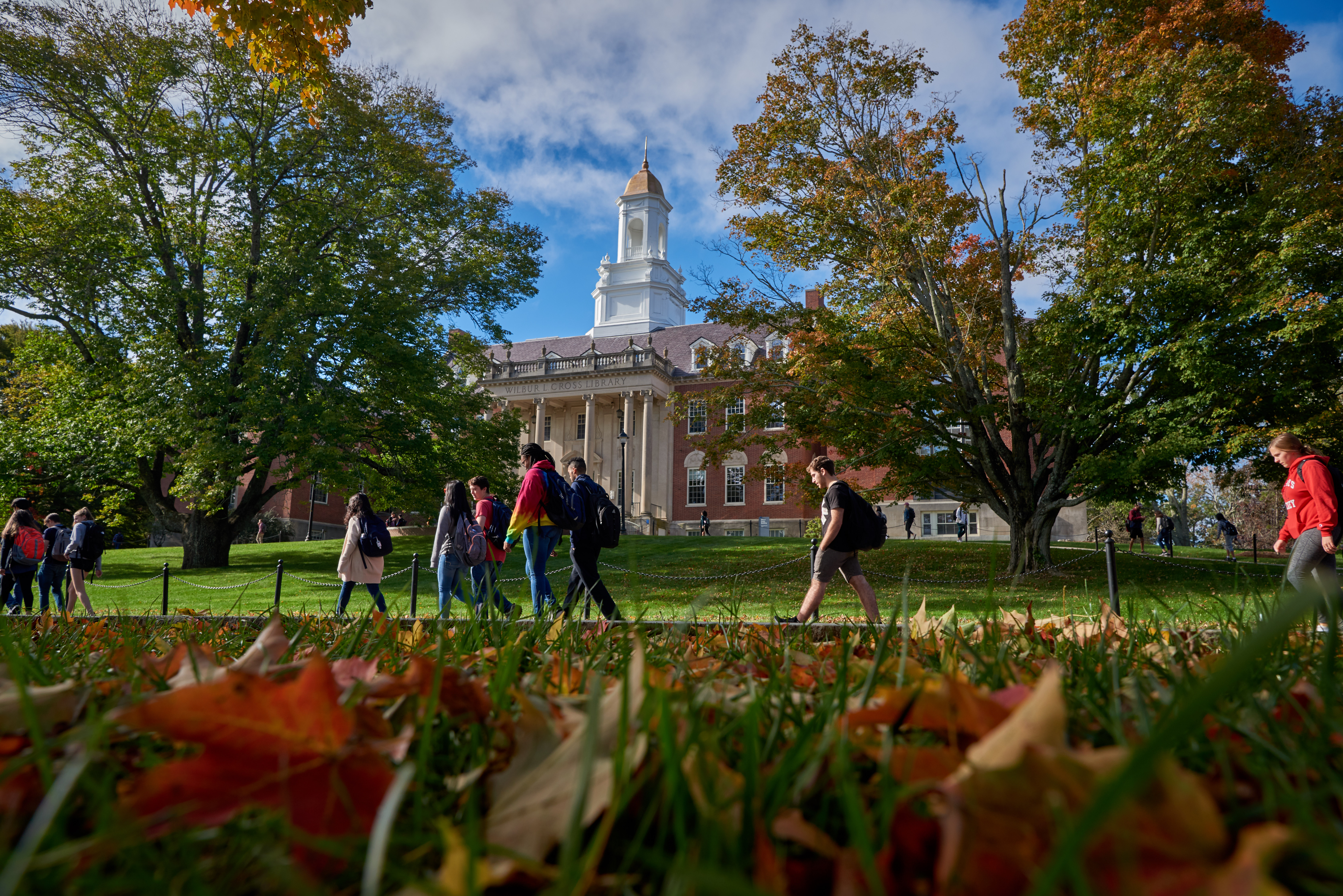 Students walk past the Wilbur Cross Building on Oct. 5, 2018. (Peter Morenus/UConn Photo)