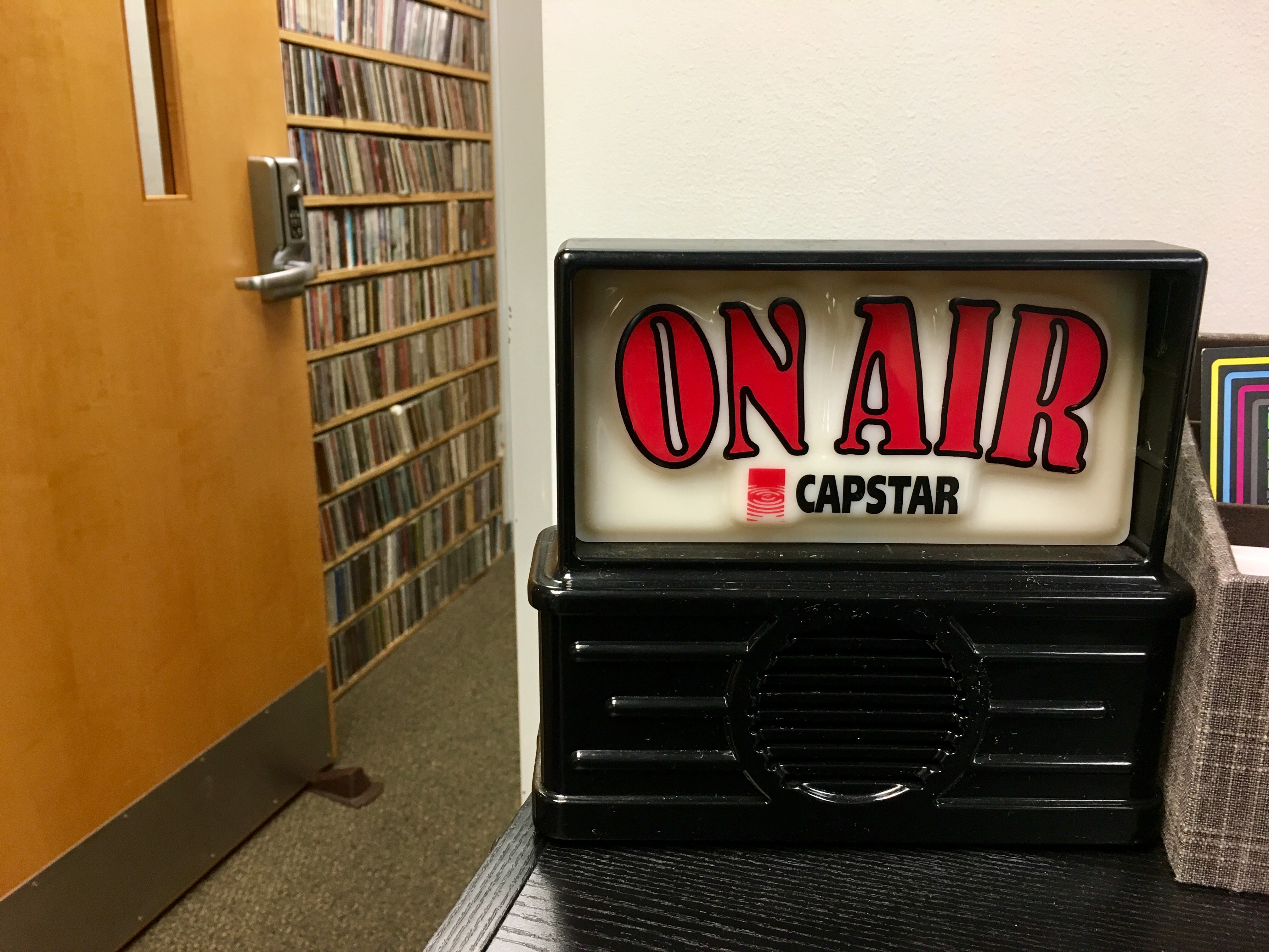 An unilluminated "On Air" light in the closed studio of WHUS.