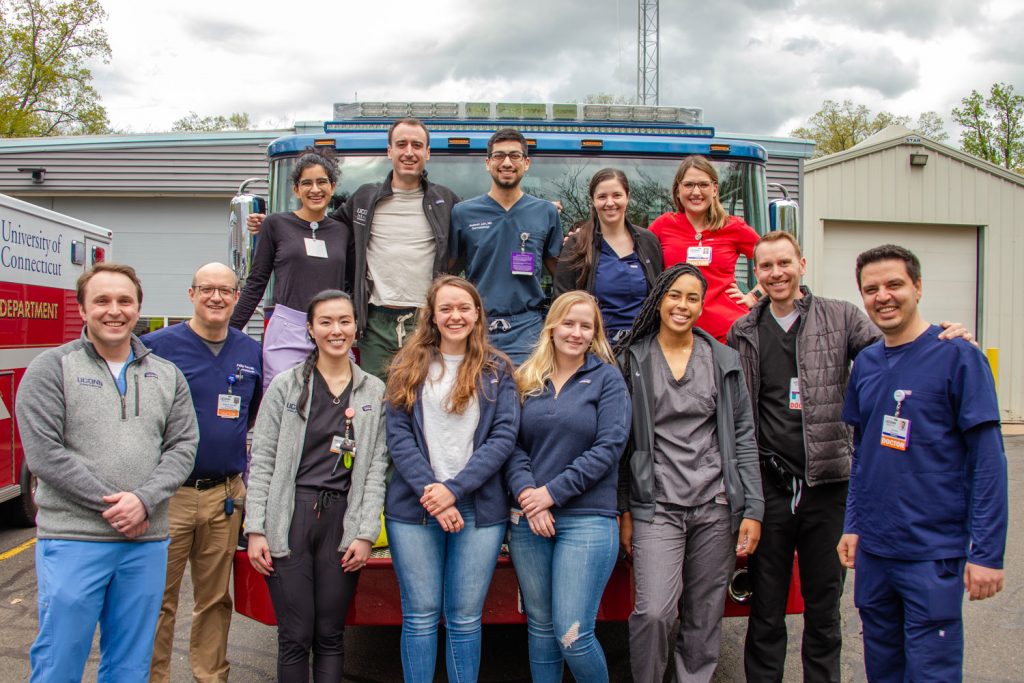 Group portrait in front of a fire truck