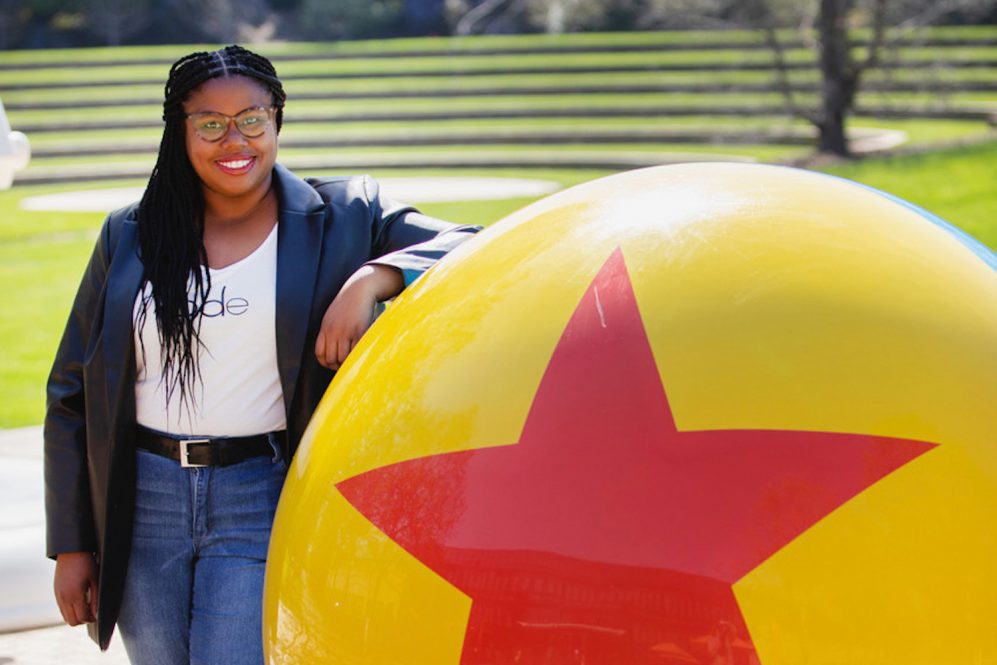 Eunice Omega standing outside of the Pixar HQ