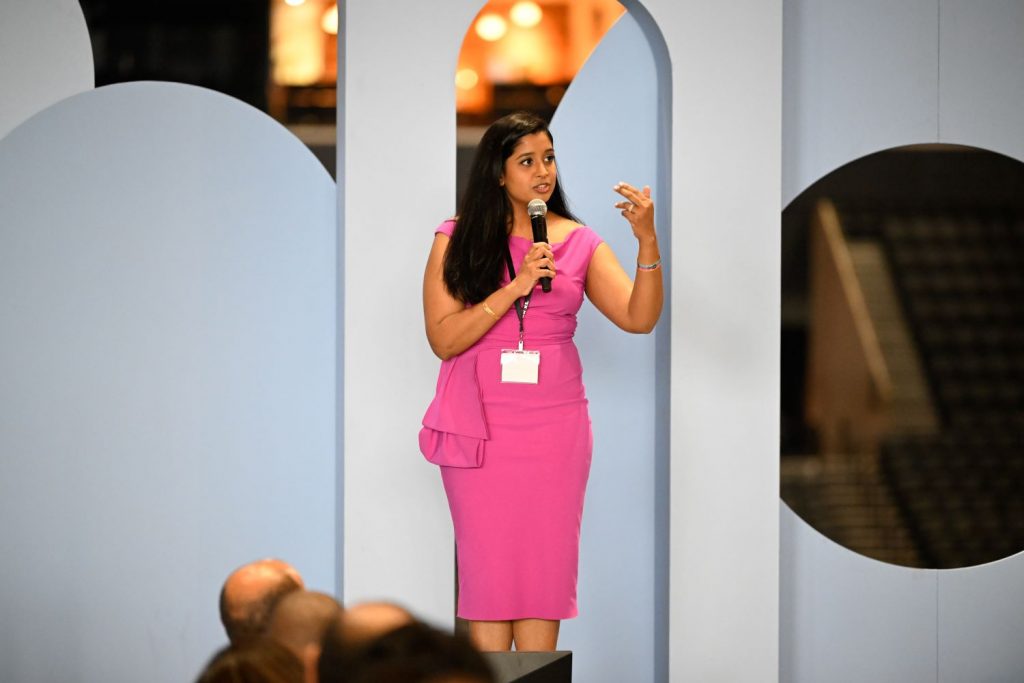 Woman in pink dress on stage