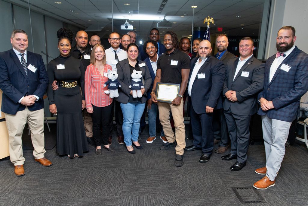 Entrepreneurship Bootcamp for Veterans (EBV)'s 2023 cohort, at their graduation ceremony. (Defining Studios)