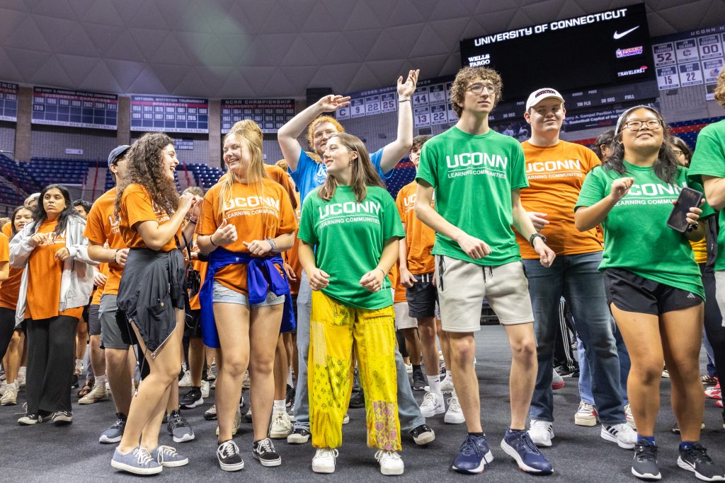 Members of UConn's Learning Communities dance during the Learning Communities Kickoff in Gampel Pavilion on Aug. 25, 2023.