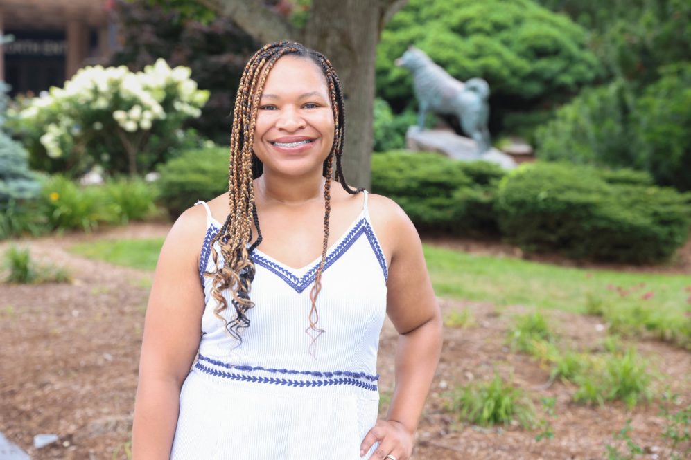 Dr. Monique Golden at the husky statue, on UConn campus in Storrs