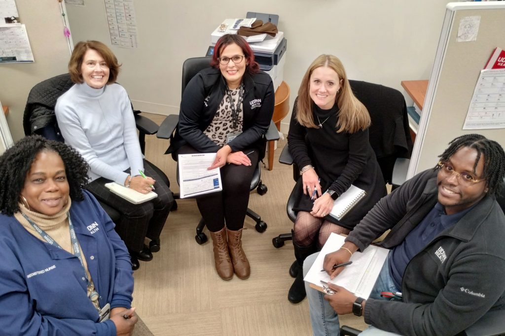 group portrait seated in office setting