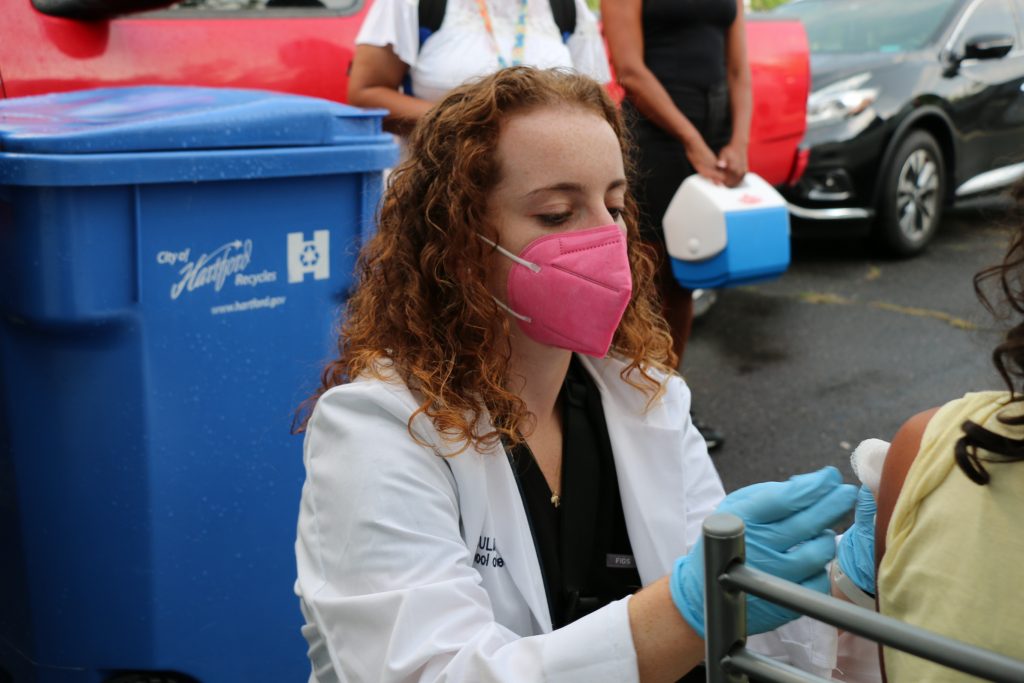 Julia Levin, is a second-year medical student and new award recipient of the Primary Care Incentive and Scholarship Program at UConn School of Medicine. Her giving back to her Connecticut community has even included the public service of going door-to-door in Hartford to give COVID-19 vaccinations.