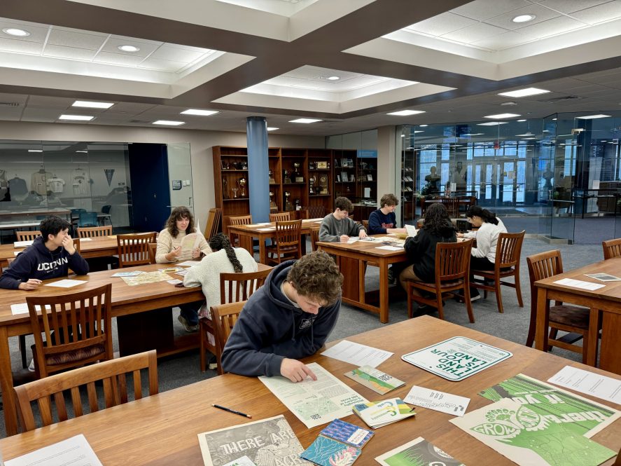 ClimateWerx students analyze materials collected at the UConn Archives & Special Collections centered around the historical ecological advocacy movements at UConn and surrounding areas with Graham Stinnett, Archivist of the Human Rights & Alternative Press Collections on February 23, 2024.