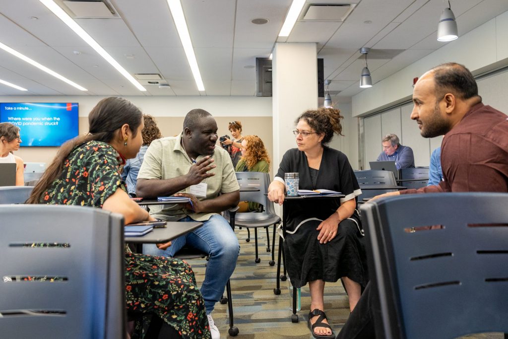 Participants of the Summer Seminar for Genocide Studies and Prevention engage in discussion during a session