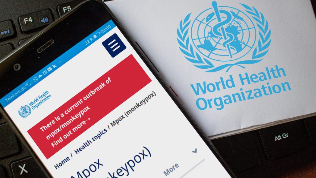 A phone screen showing information about mpox next to the World Health Organization logo.