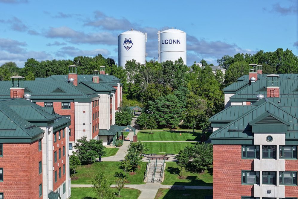 An aerial view of the UConn-branded water towers and Towers residence hall complex