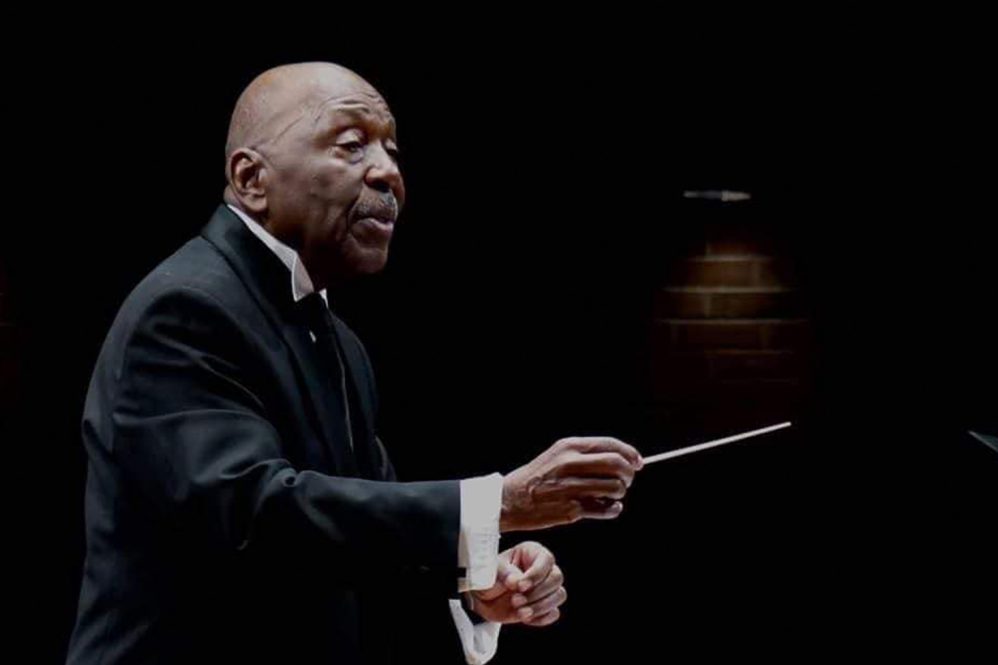 Former UConn choral director, the late Peter Bagley, directing a choir concert.