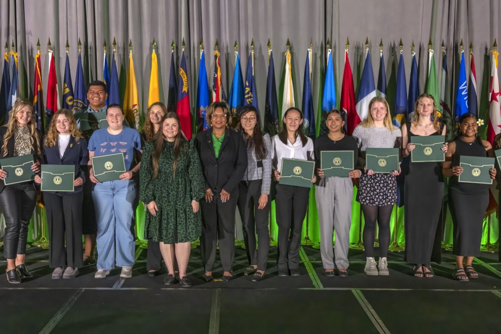 Youth holding certificates