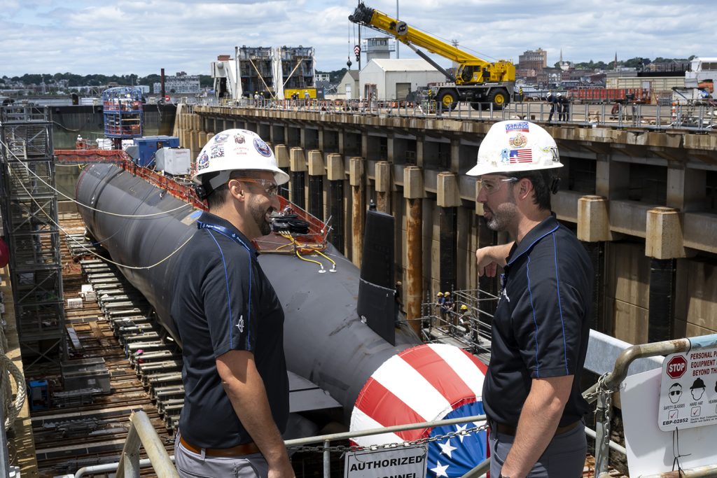 Alumni Matthew Gravell ’09, Director of Program Finance at General Dynamics-Electric Boat in Groton, and Shane Driscoll ‘10, Director of Operations, observe the PCU Idaho before Float Off. Gravell will be honored with The Hartford Business Journal’s 40 Under Forty award this month. The two men were undergraduate roommates at UConn before becoming colleagues.